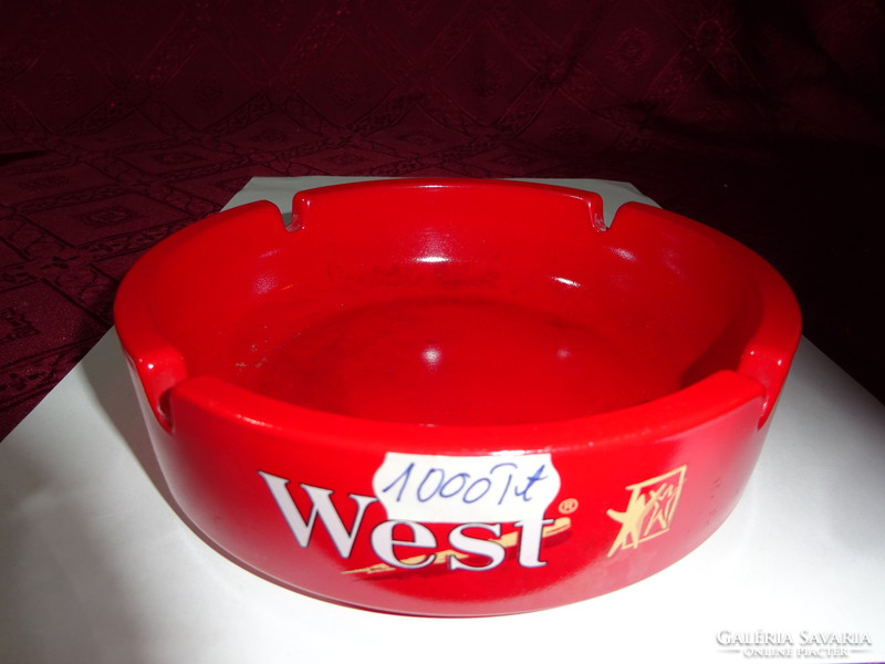 Red glass ashtray, diameter 14.5 cm. Inscribed West. He has!