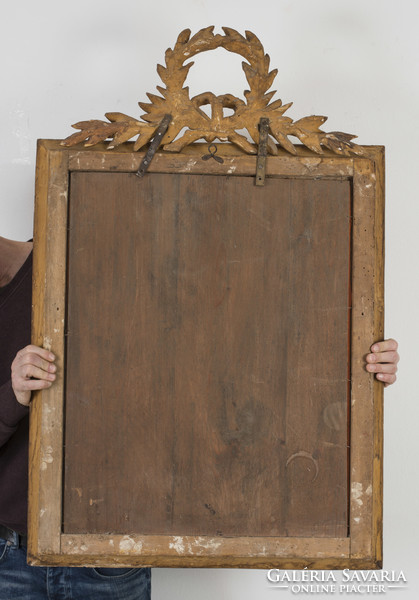 Gilded wooden framed mirror with laurel wreath decoration