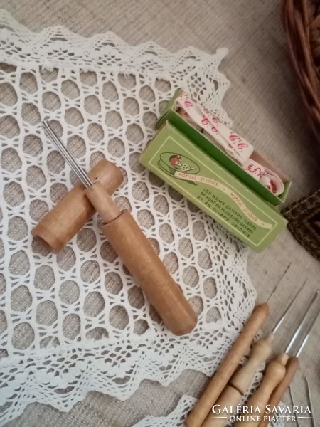 Old wicker basket inside crocheted tablecloth crochet needle with wooden needle holder pincushion wooden ornament buttons scissors