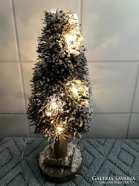 Christmas decoration with illuminated fir tree
