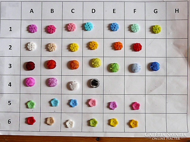 About 12 mm flower buttons from the collection for clothes, bags, plastic
