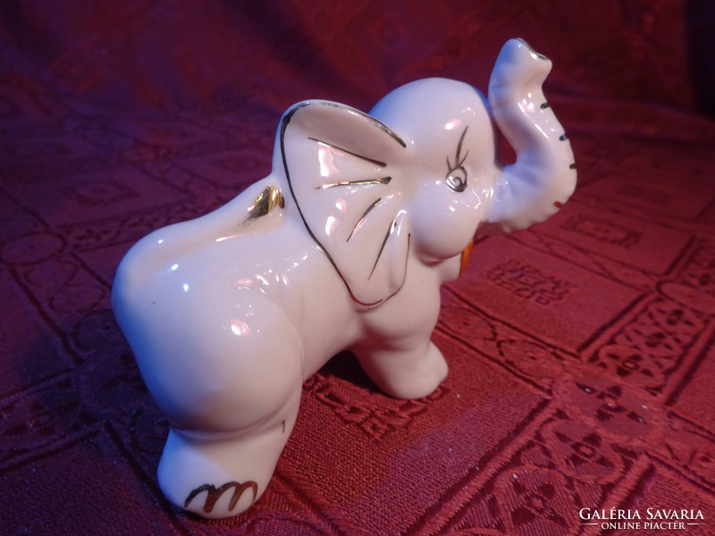 German porcelain elephant, pink body with gold decoration, length 9 cm. He has!