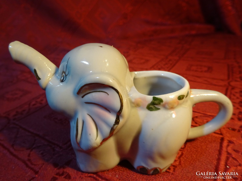 German porcelain elephant, gray base, pink handle, pouring function. He has!