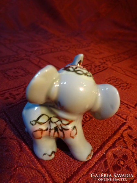 Em & em exclusive German porcelain elephant puppy, height 4.5 cm. He has!