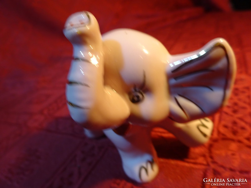 German porcelain elephant, pink body with gold decoration, length 9 cm. He has!