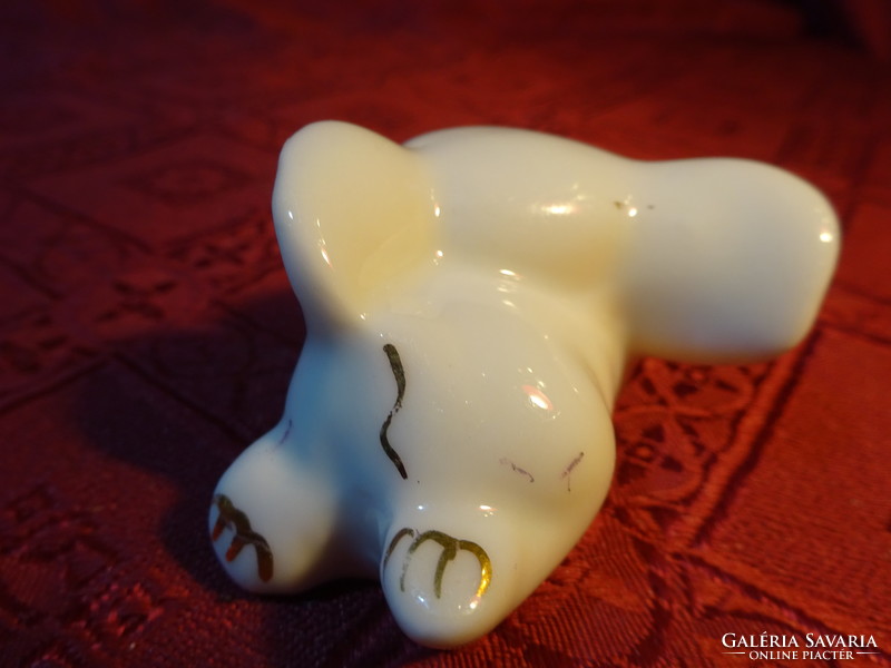 German porcelain, little elephant lying on its stomach. Length 6 cm. He has!