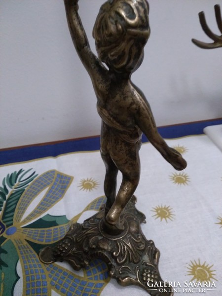 Bronze putto candle holder