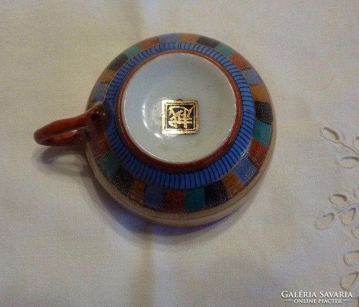 Oriental porcelain coffee cup and plate