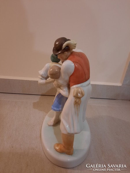 Herend watering cans, a pair of porcelain figurines watering