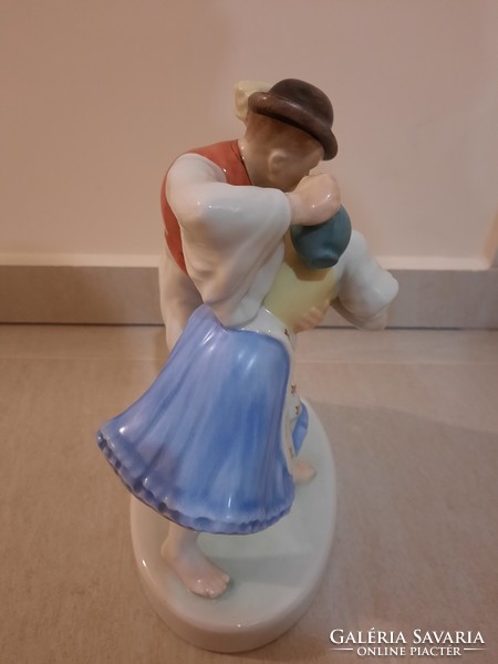 Herend watering cans, a pair of porcelain figurines watering