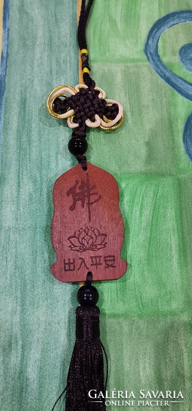 Real room. Rosewood pendant, amulet, avalokitesvara