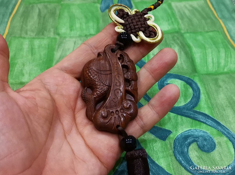 Real room. Feng shui rosewood pendant, amulet, abundance, happiness