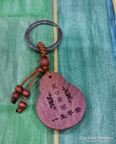 Real room. Rosewood key ring, laughing Maitreya Buddha