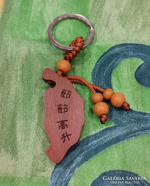 Real room. Feng shui rosewood key ring, butterfly on bamboo