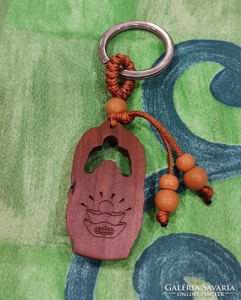 Real room. Feng shui rosewood keychain, symbol of wealth