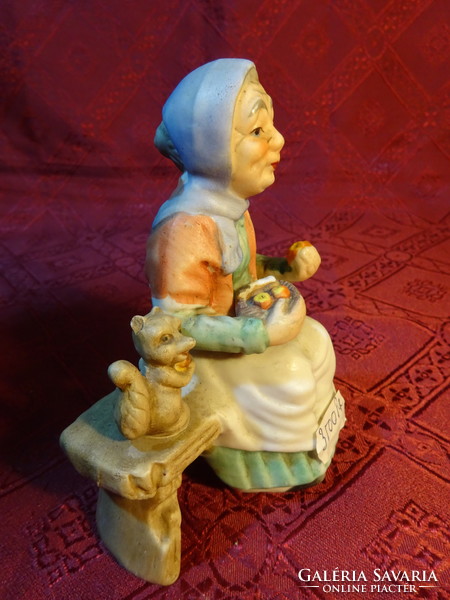 Porcelain figure, aunty with her kitten, height 13 cm. He has!