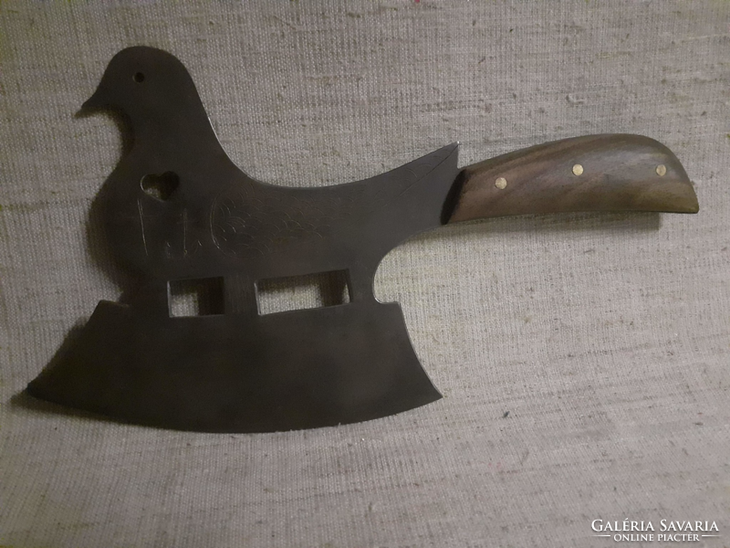 Pigeon shaped ax with wooden handle