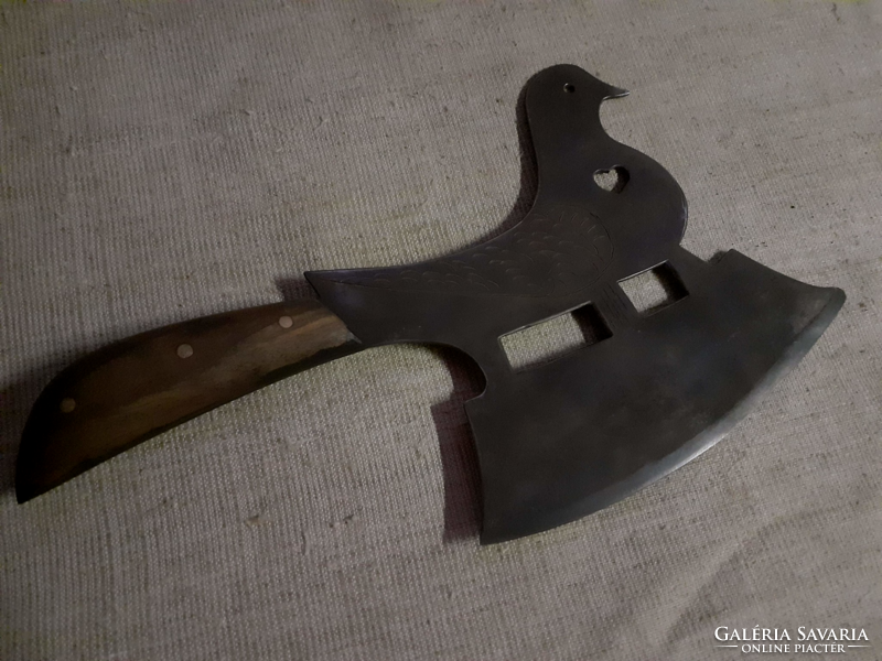 Pigeon shaped ax with wooden handle