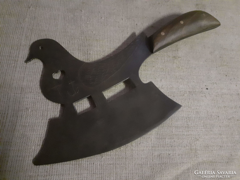Pigeon shaped ax with wooden handle
