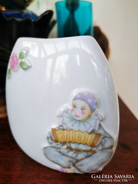 Small accordion pierrot on the vase