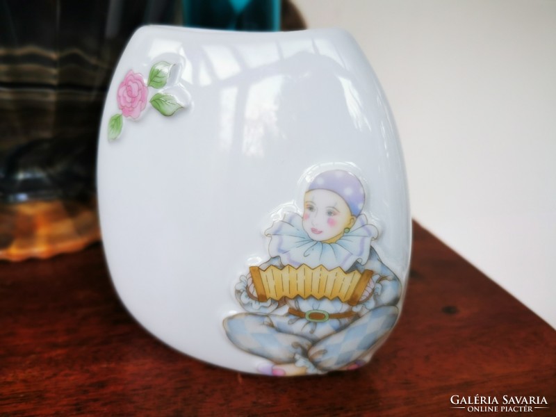 Small accordion pierrot on the vase