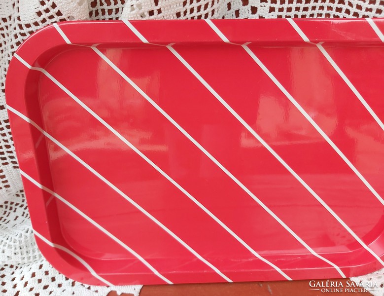 Retro metal plate tray with white stripes on a red background, collector's item, nostalgia enamel