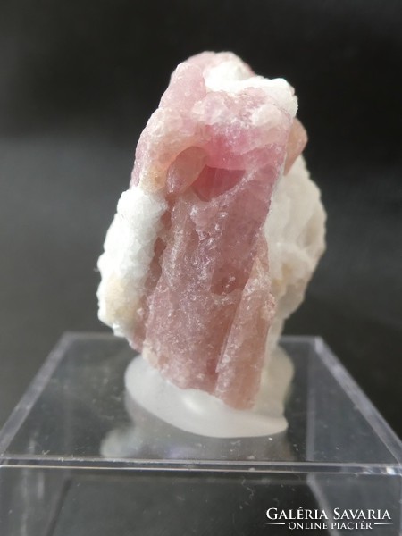 Natural rubellite (tourmaline version) crystals in the bedrock. Collector piece attached to a holder