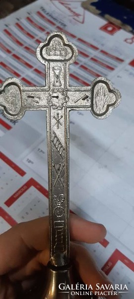 Marked metal crucifix with two candle holders.