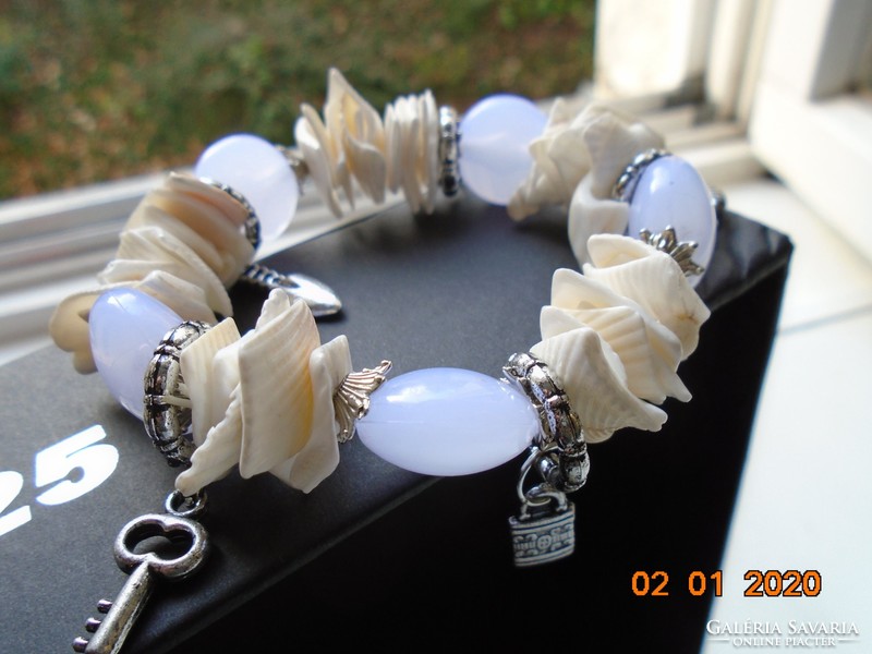 Shell and pale purple glass beads in a silver-plated socket, bracelet with silver-plated pendants