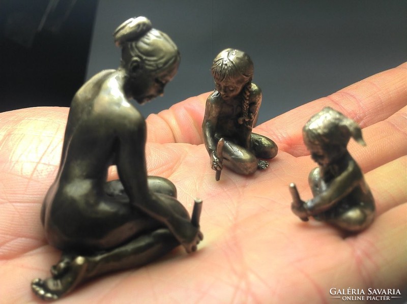 Miniature bronze statue of mother with her children