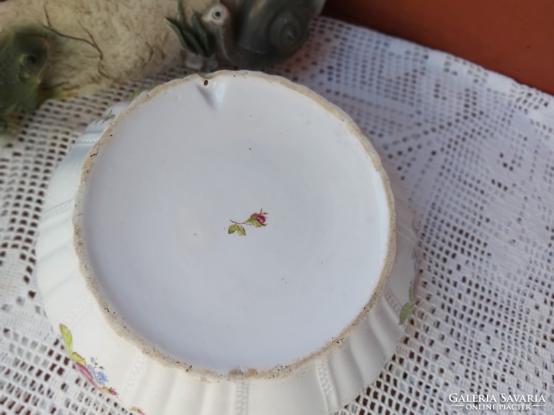 A porcelain bowl with a beautiful pattern of flowers with pink scones, rustic decoration