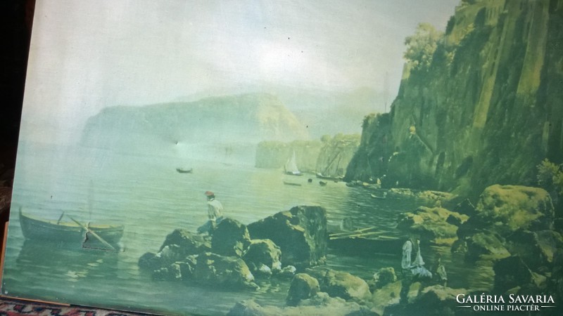 Rocky coastal bay with old large oil print on scratch