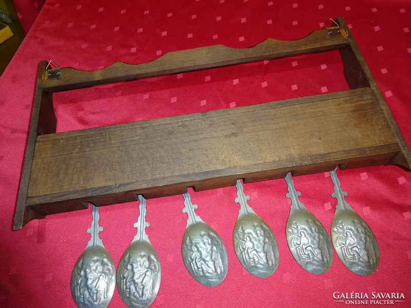 German tin embossed spoon (six pieces) and three bowls with wooden holder.