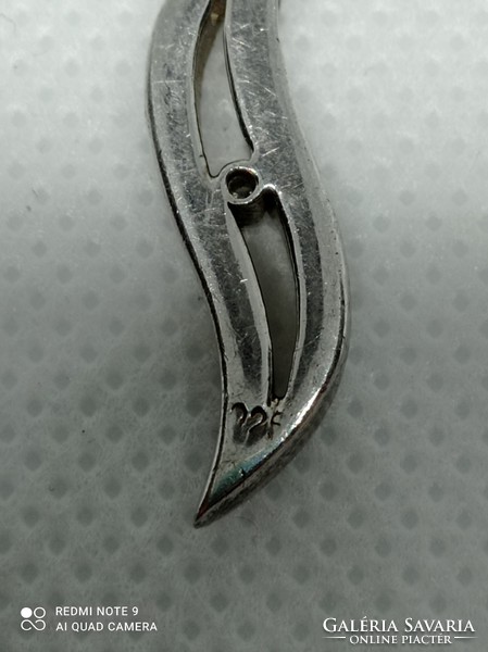 Silver pendant with glasses