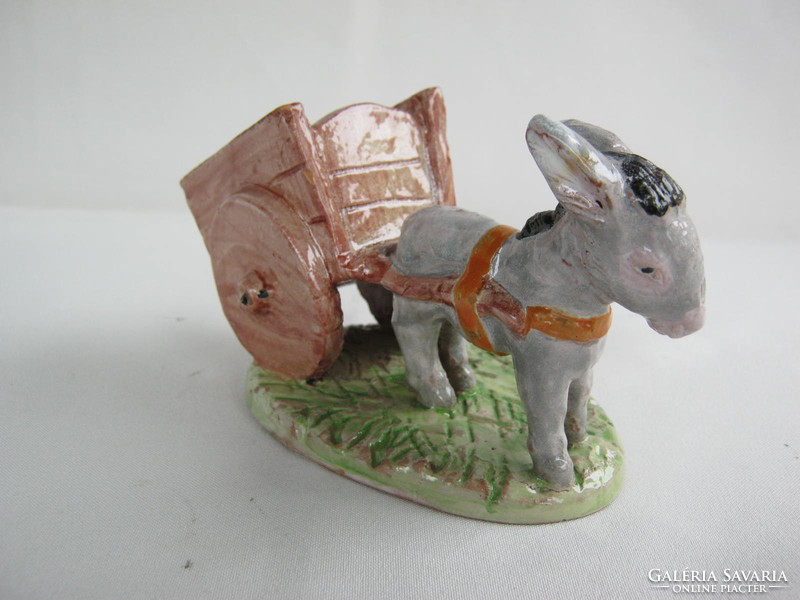 Donkey pulling a sweaty ceramic cord