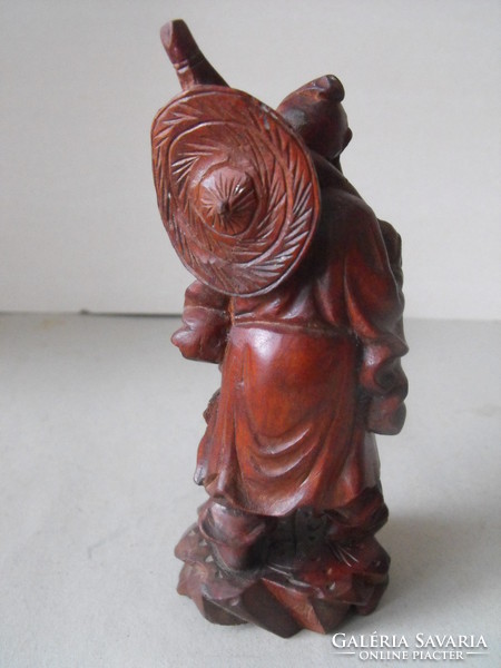 Oriental wanderer, wood carving