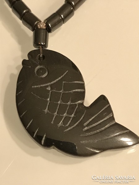 Hematite necklace with carved fish pendant,