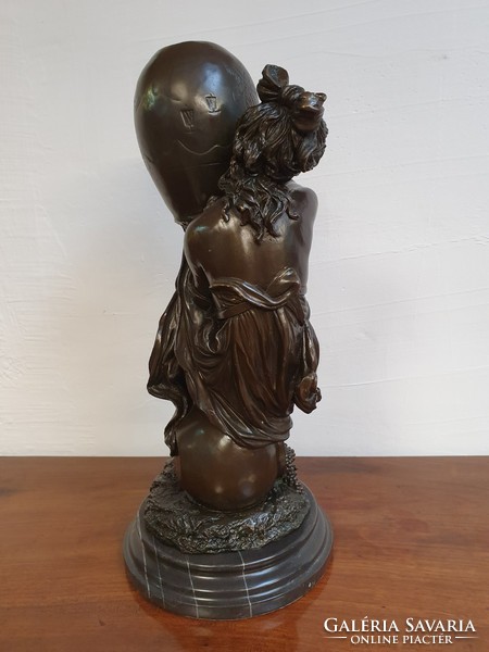 Female figure bronze statue on marble pedestal