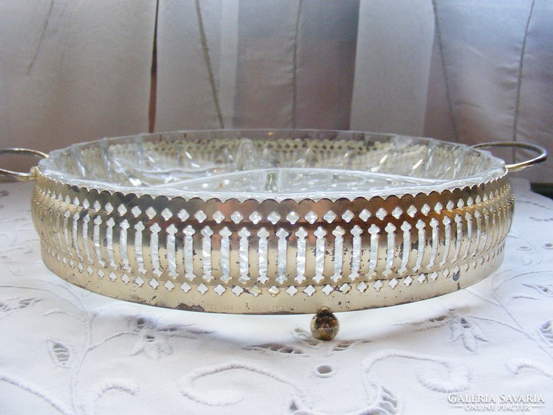 Split glass bowl with metal placemat, serving dessert glass