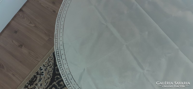 A round azure tablecloth with a diameter of nearly 2 m