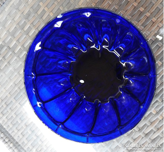 Violet glass bowl centerpiece with iron frame on legs
