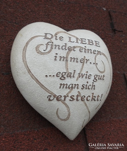 You can't run away from love... Stone heart with German inscription
