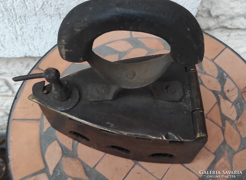 Antique copper, bronze iron. It is at least 100 years old. It weighs almost 3 kg!