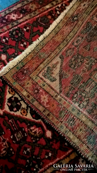 Old hand-knotted wool carpet in beautiful colors.