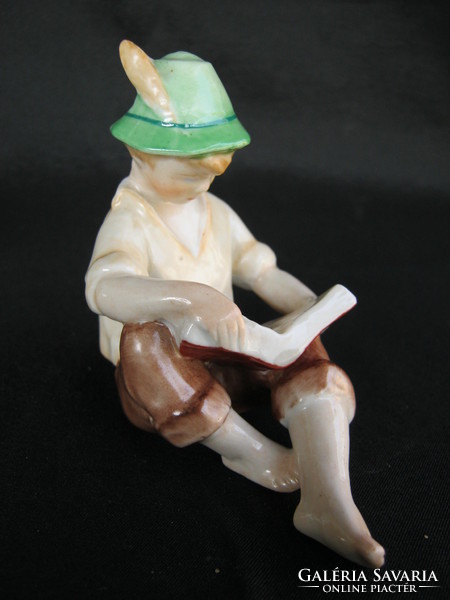 Boy reading a porcelain book in Kőbánya