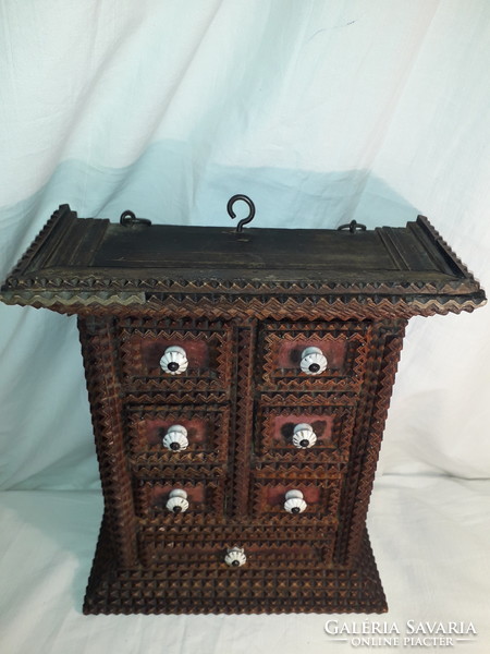 Antique tramp art 7-drawer hand-carved wooden spice cabinet from the early 1900s