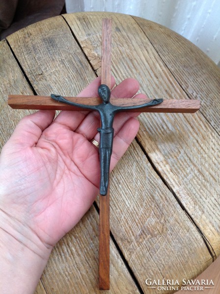 Old wooden crucifix with cast iron body