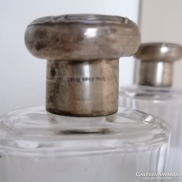 Old bottles with silver tops individually