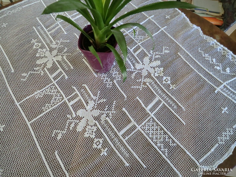 Festive lace tablecloth 120x120 on table with delicate lace