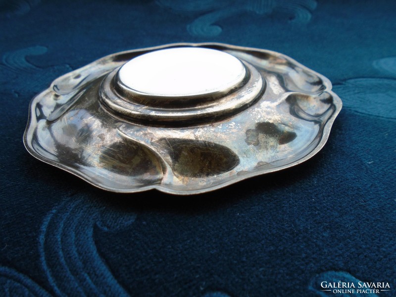 A small bowl with a silver-plated patina with an Art Nouveau embossed rim